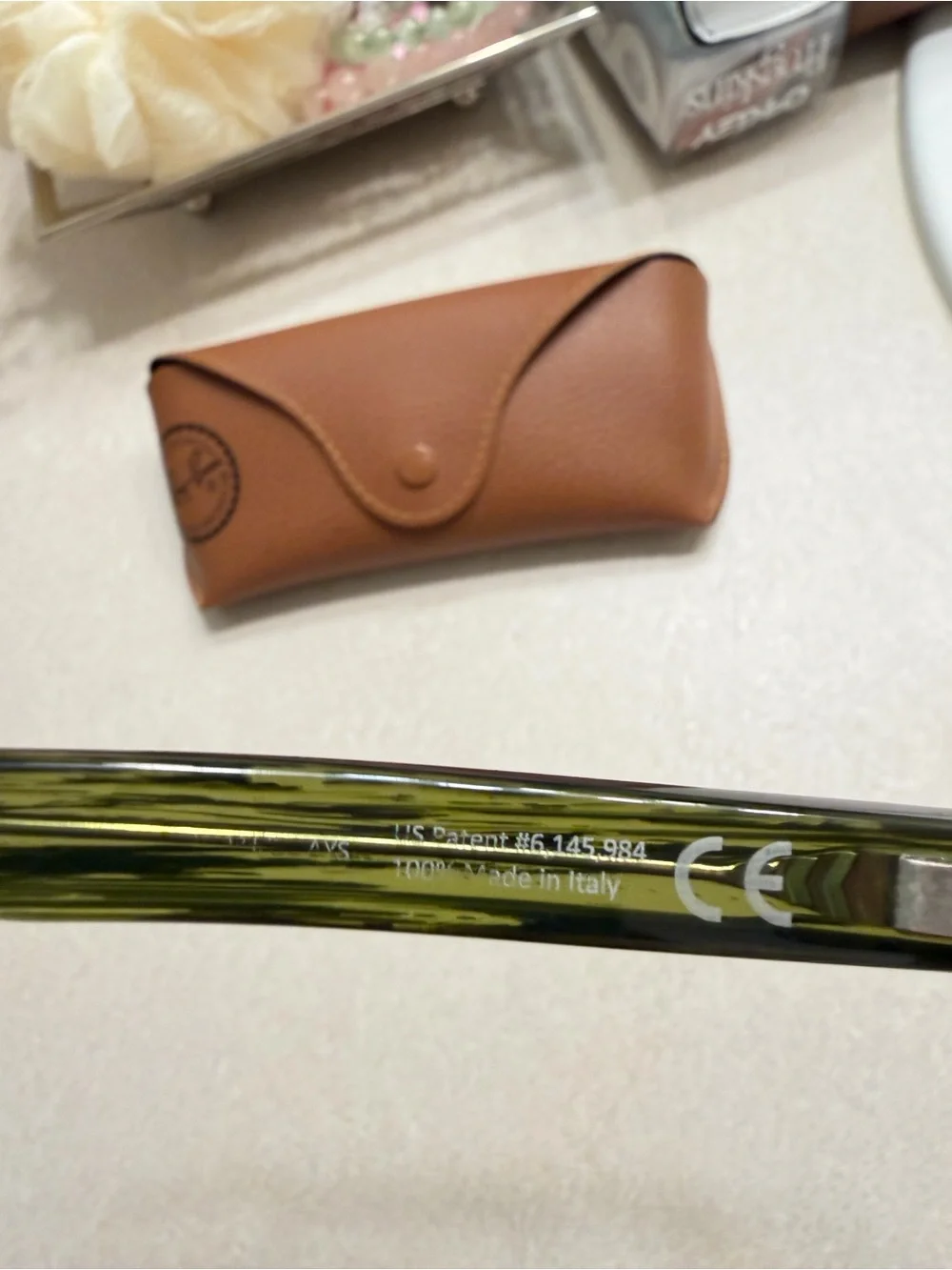Maui Jim Black Frame Sunglasses with Green-Tinted Lenses